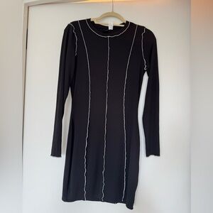 Black long sleeve mini dress with White Stitching detail